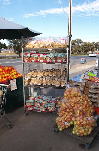 outside pallets of nuts and fruit